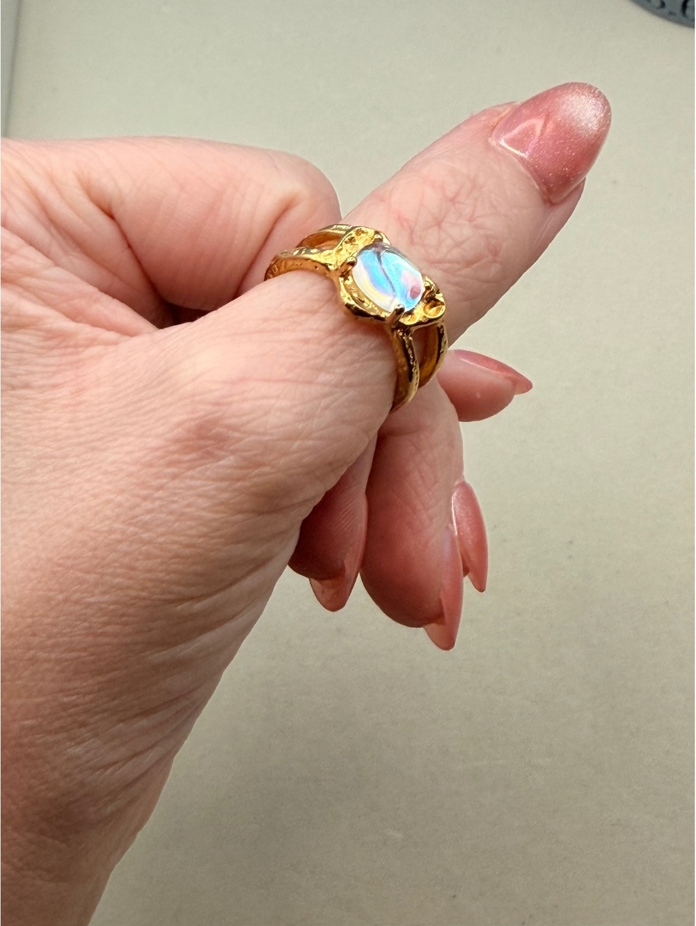 Gold tone opalescent oval adjustable ring